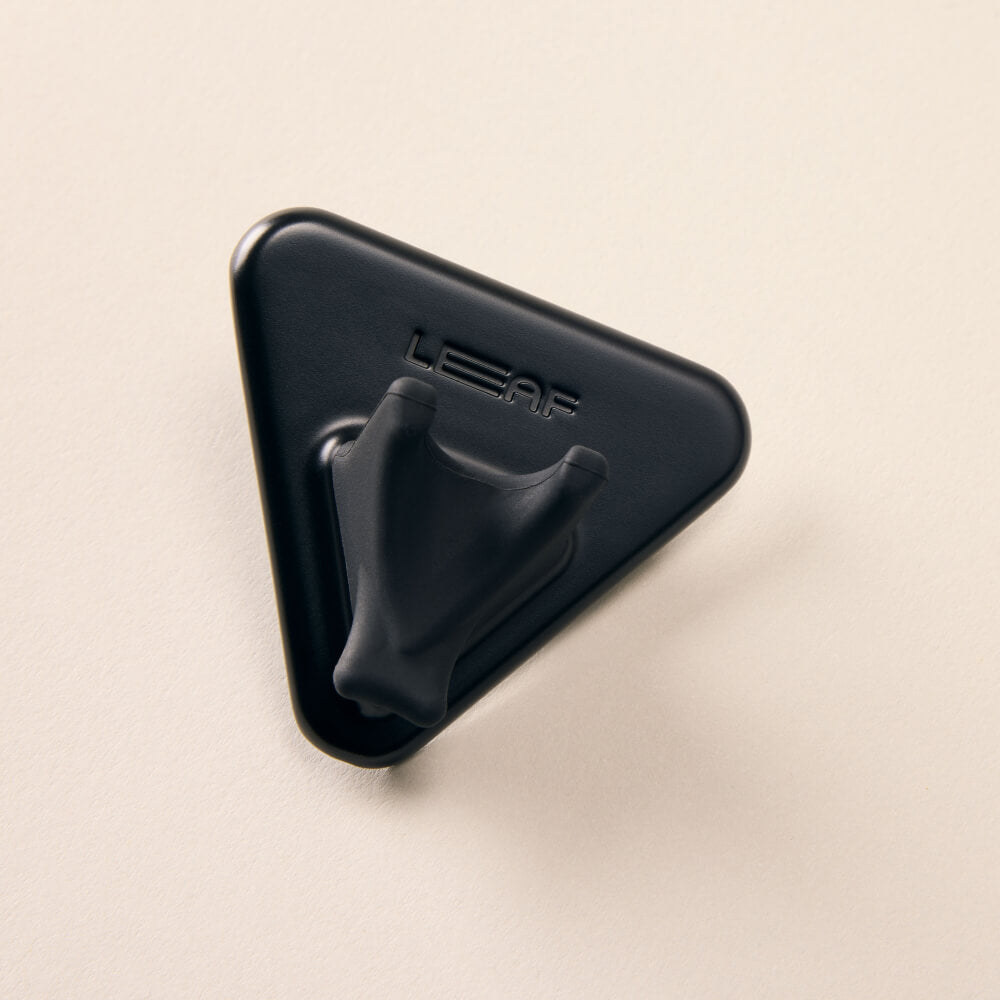 A black razor shower holder