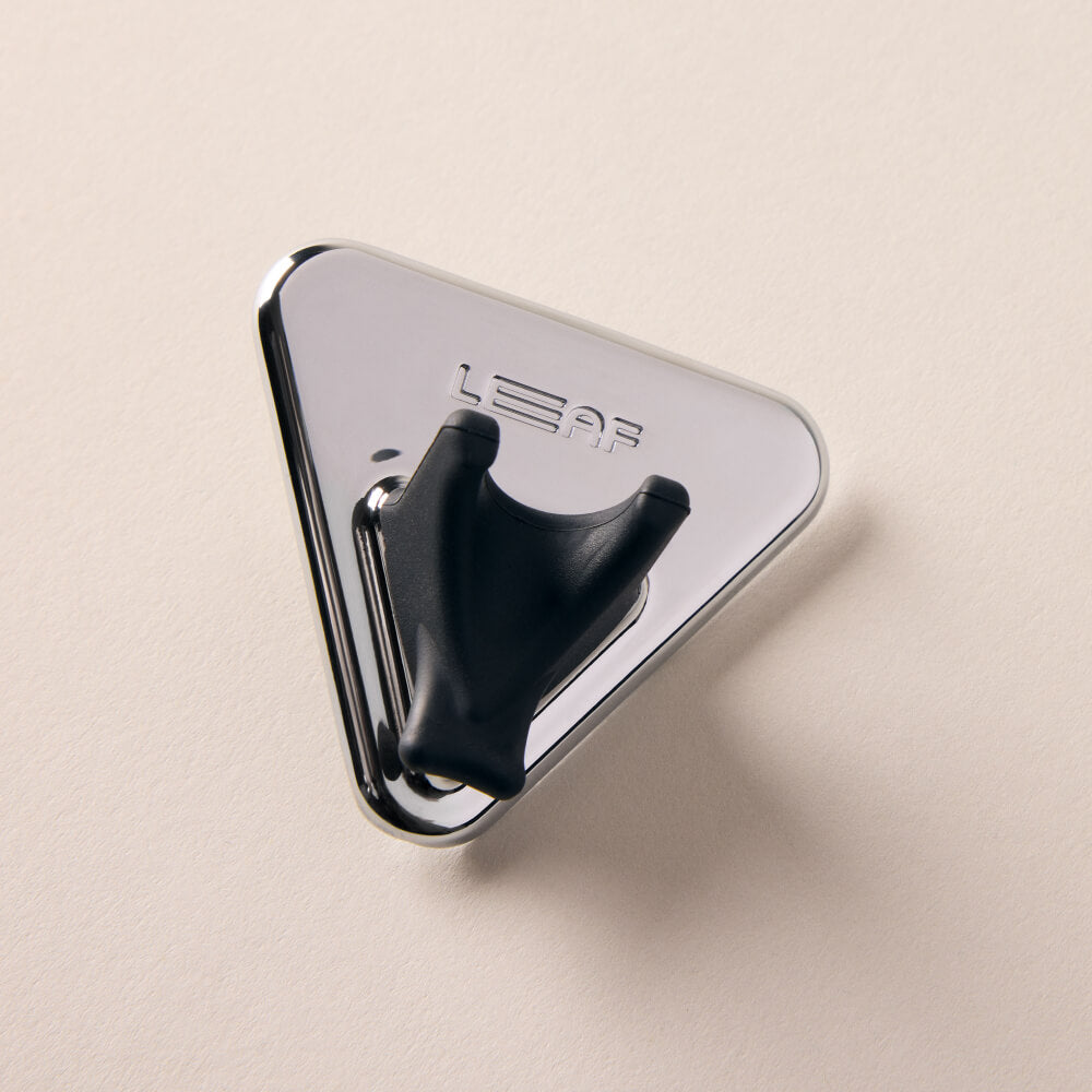 A chrome razor shower holder